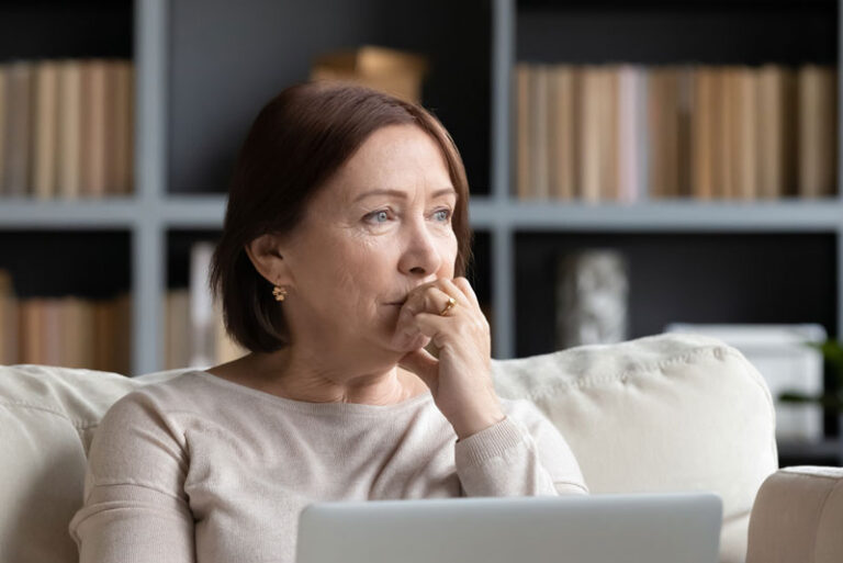 Woman Wondering The Difference Between Denture Implants And Traditional Dentures