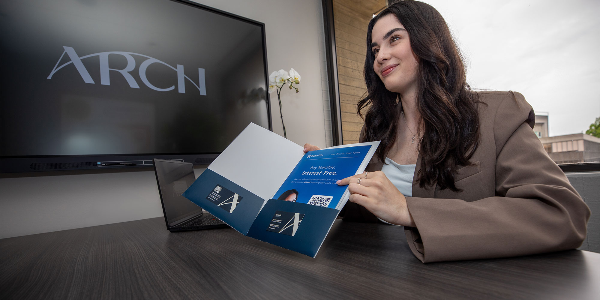 team member holding a folder of insurance papers
