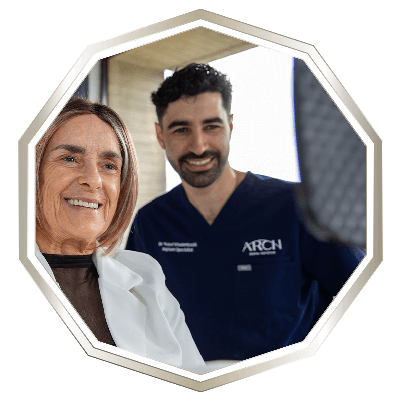 Patient and Doctor Smiling into mirror