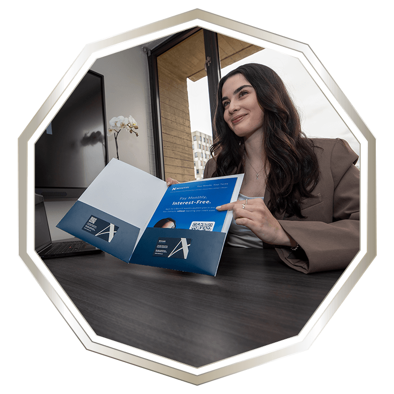 team member showing patient insurance papers
