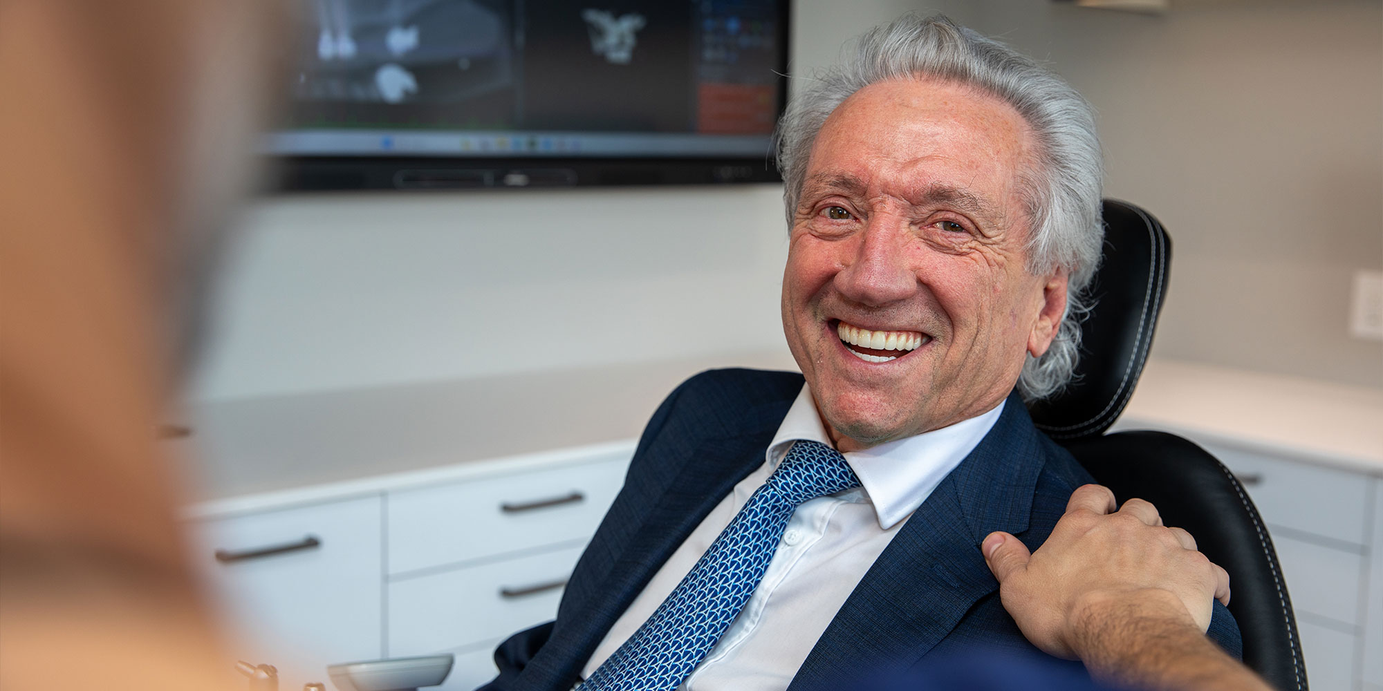 Paitent smiling at doctor