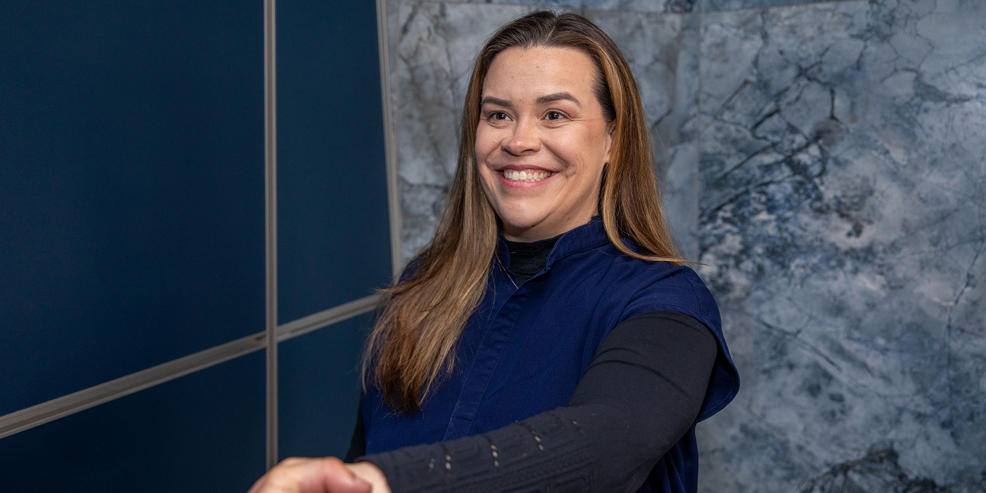 team member shaking Patients hand