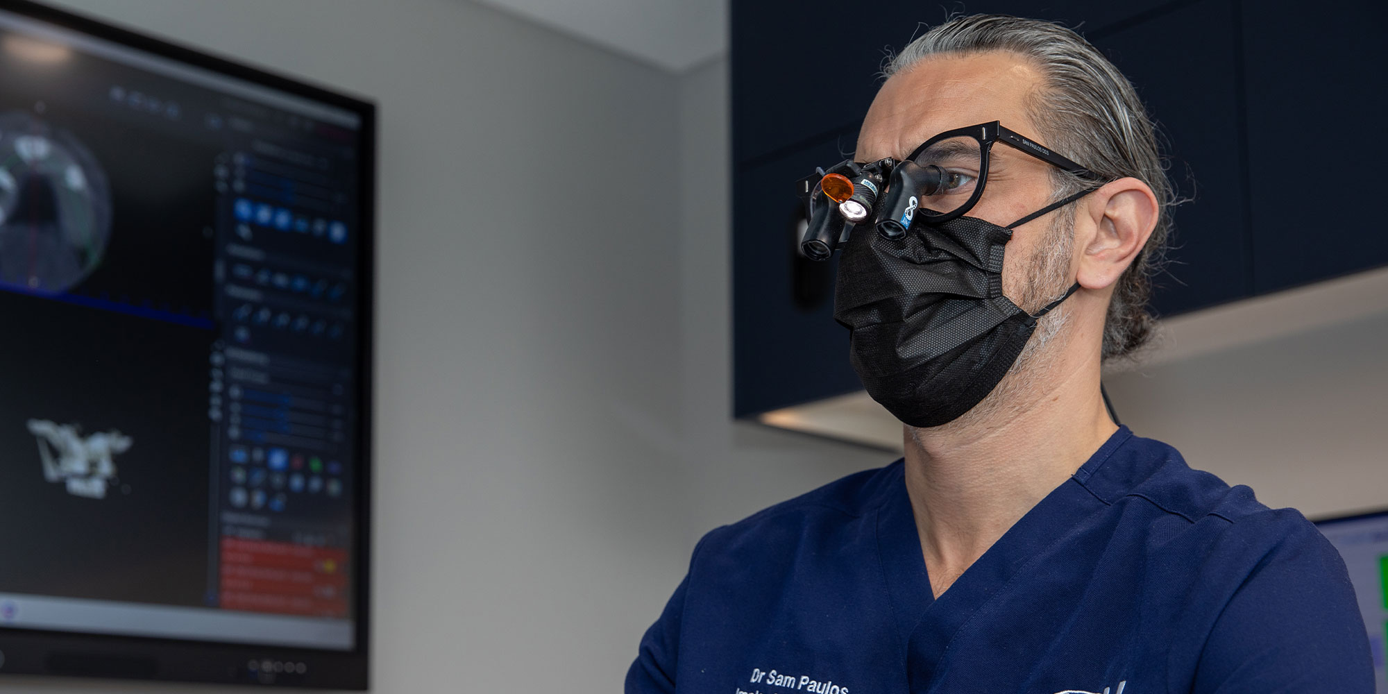 doctor in the middle of Checking Patients teeth