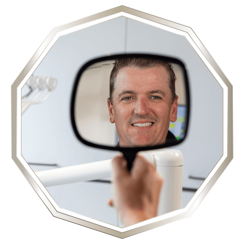 man looking into mirror